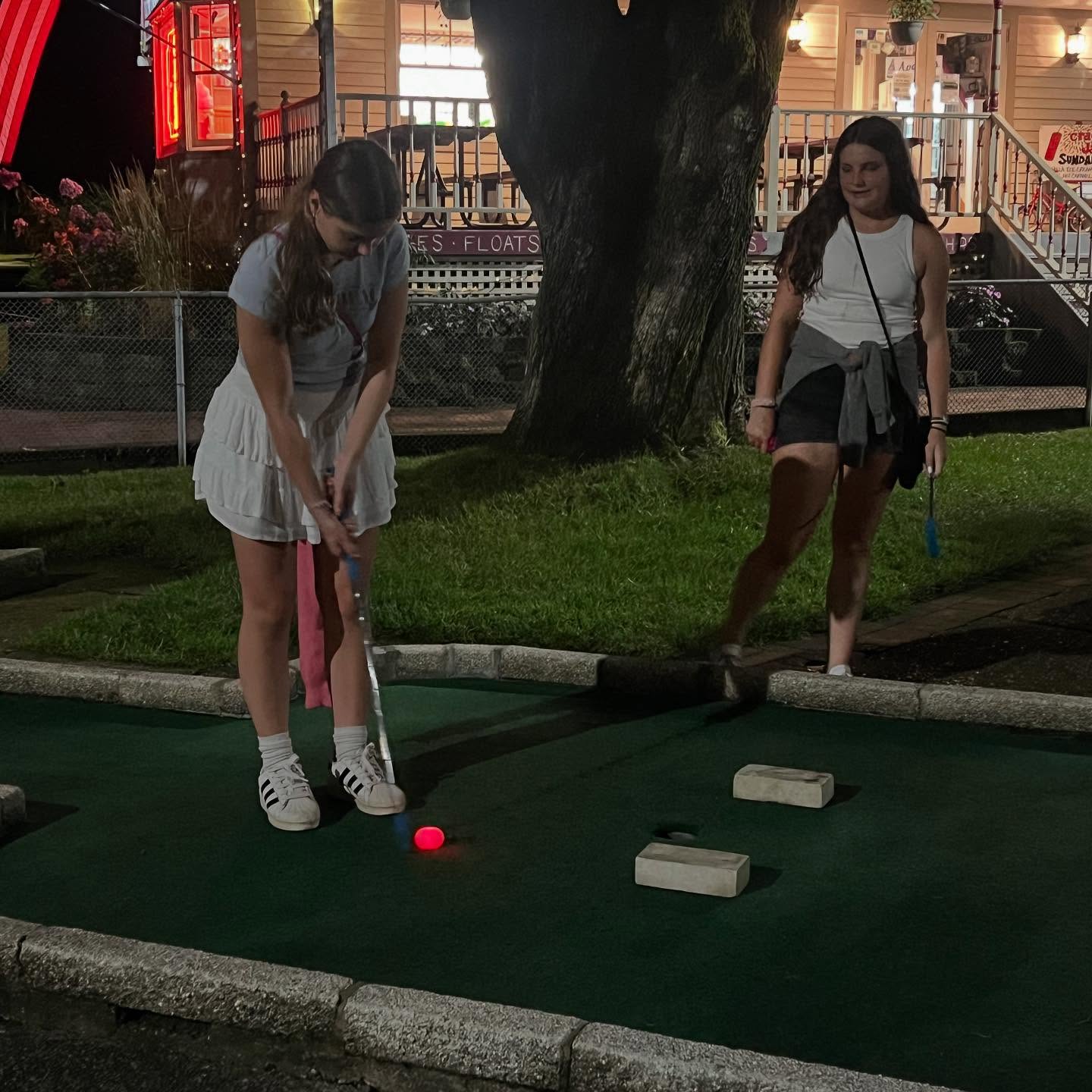 Teams playing under UV lights at the Glow Ball Tournament